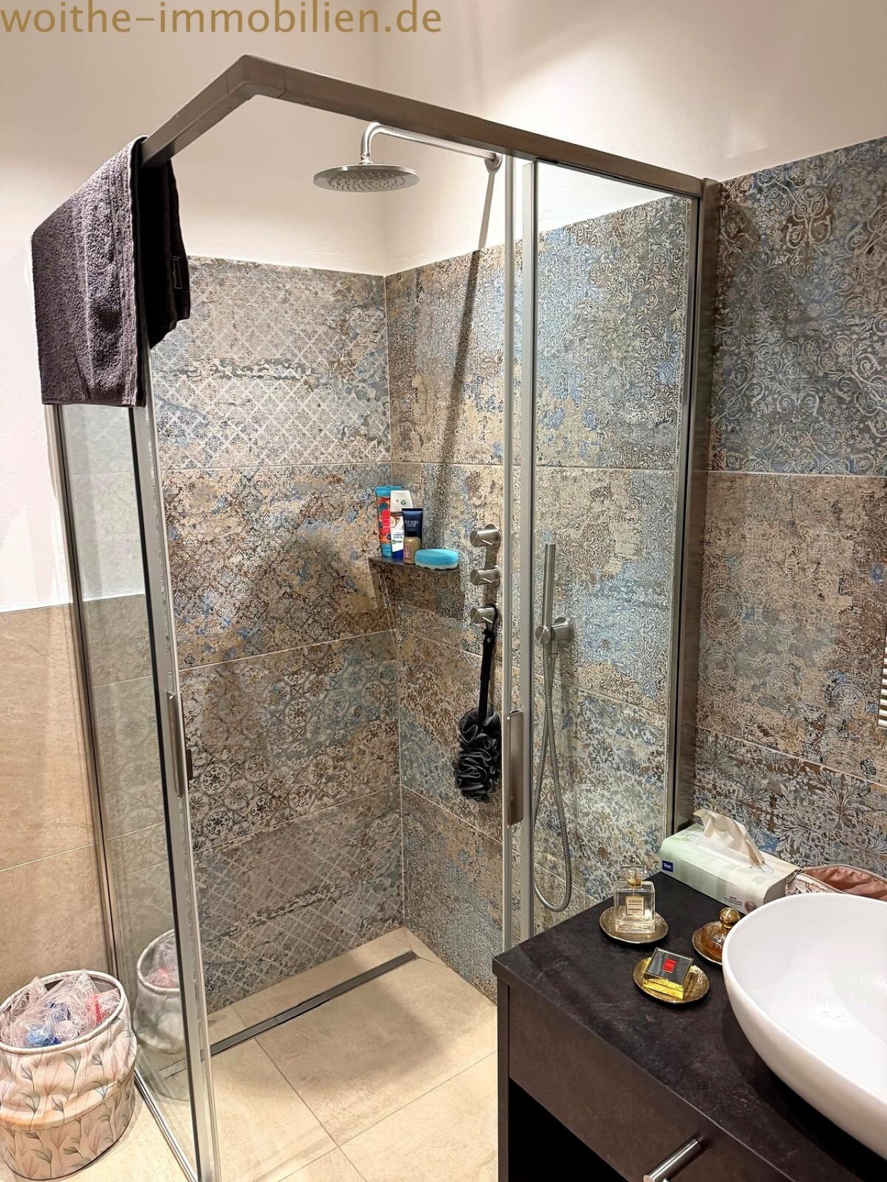 Modern shower bathroom with walk-in shower and high-quality glass partition. Modern shower bathroom with walk-in shower and high-quality glass partition.